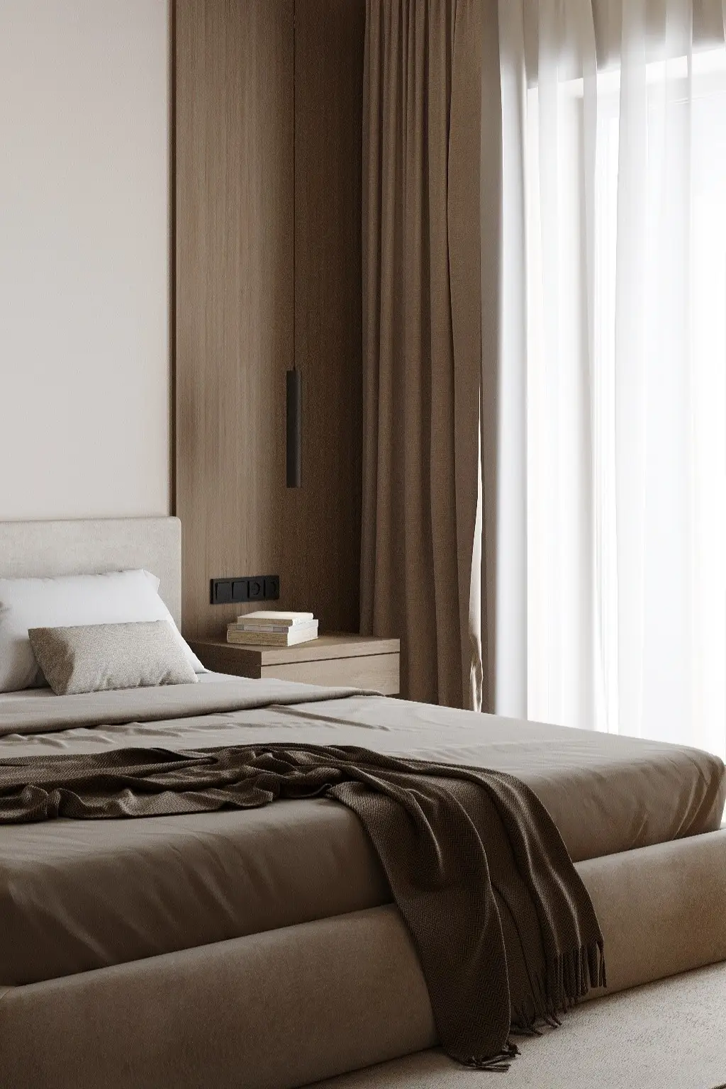 Minimalist bedroom with soft neutral tones, layered textiles, and natural daylight
