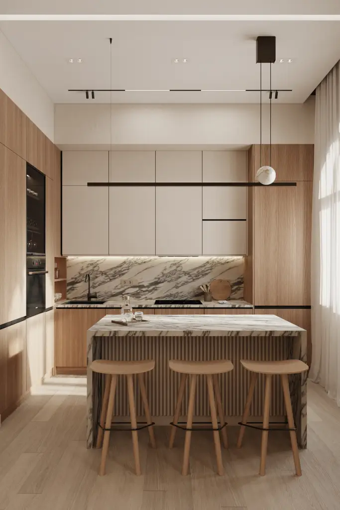 Japandi style kitchen with light wood cabinetry and a marble island